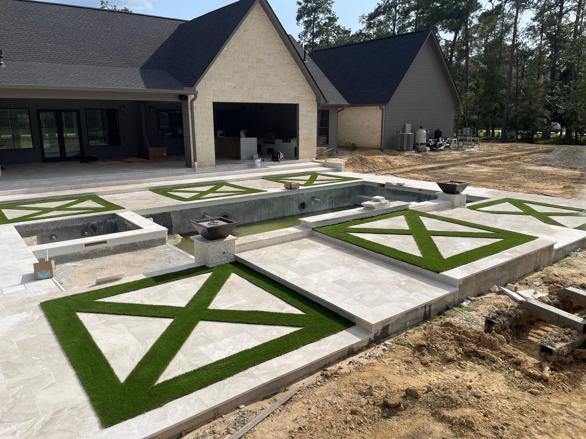 Luxury pool deck with geometric turf panels, Lumberton TX